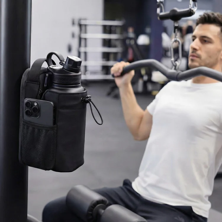 Person training on a machine with the gym bag attached nearby