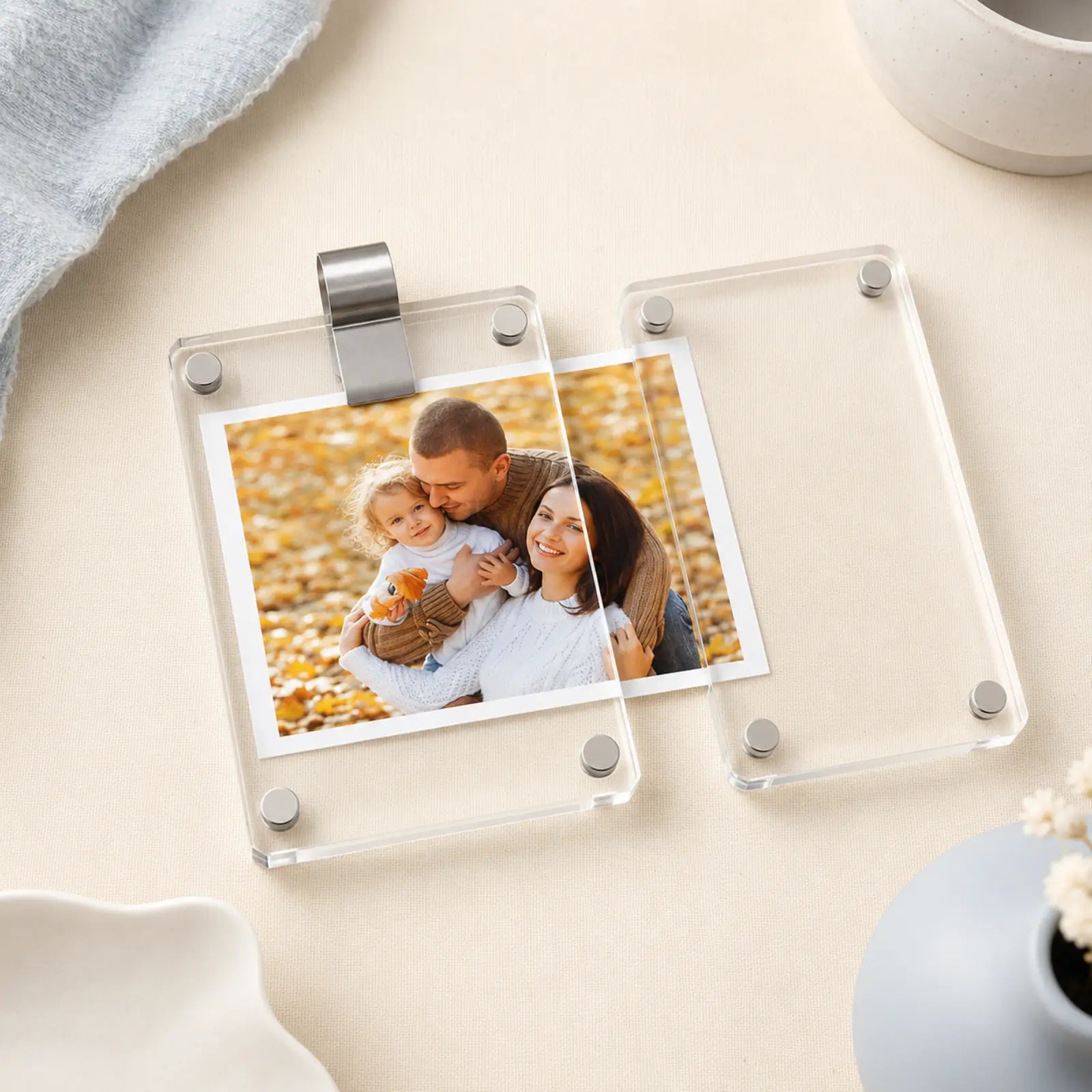 CloseBy frame opened with a photo partly removed and its stainless spring steel visor clip visible.