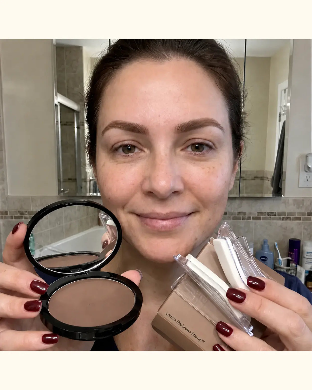 Customer holding the Looma eyebrow compact and reusable brow stamps, with no floating logo overlay.