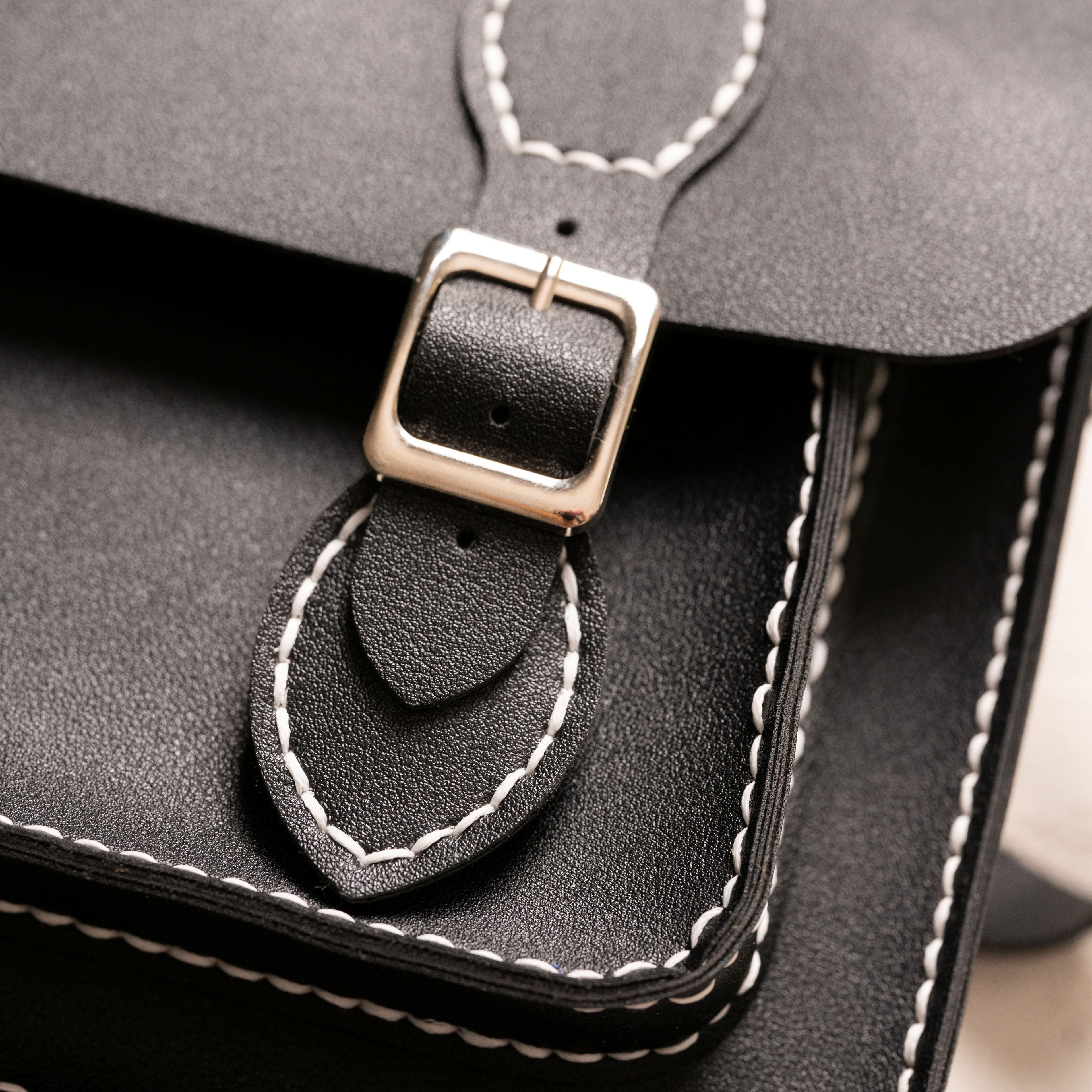 Liliora Black buckle and stitching detail