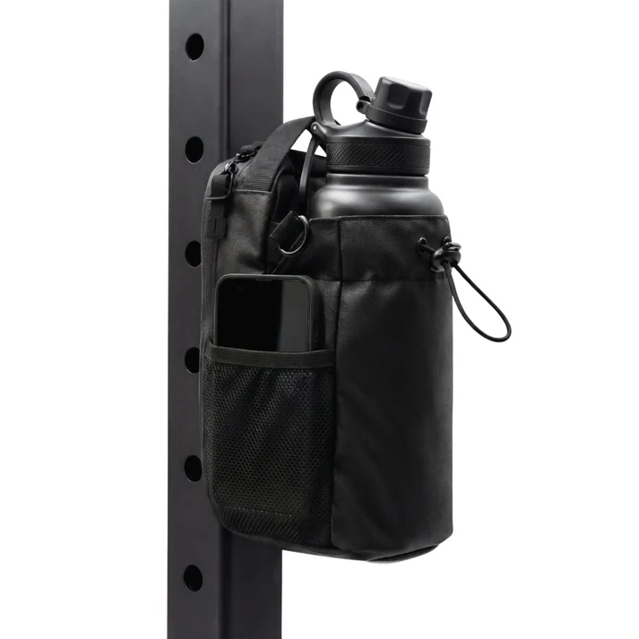 Black Looma magnetic gym bag with bottle holder attached to a compatible steel gym rack