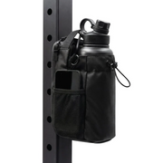 Black Looma magnetic gym bag with bottle holder attached to a compatible steel gym rack