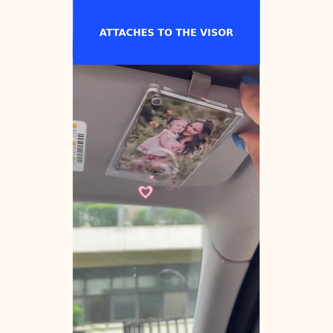 Silent demonstration of attaching a CloseBy photo frame to a car sun visor.