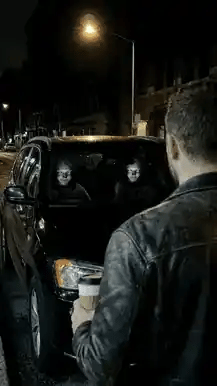 Animated outside view of the installed Creepy Face Car Headrest Covers at night